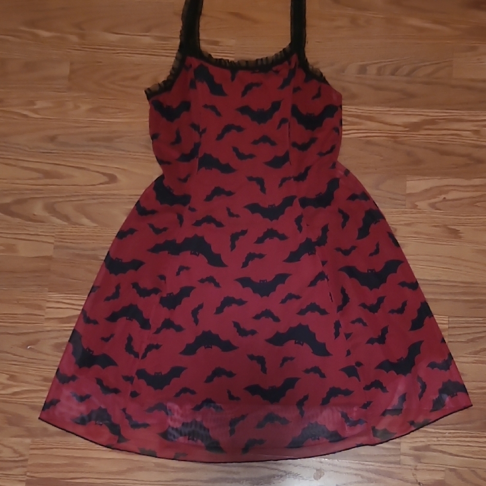 Red dress with black bat pattern.
